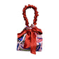 RED SATIN & PAISLEY MOTIF REVERSIBLE MINI BUCKET BAG